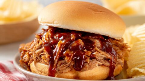 Slow cooker texas pulled pork with BBQ Sauce, served with chips